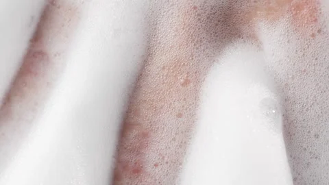 Female Hands Playing with Soap Bubbles in Bathtub Close-Up Stock Footage 317317022