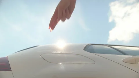 Female hands plugging in the EV charger Stock Footage 158866065