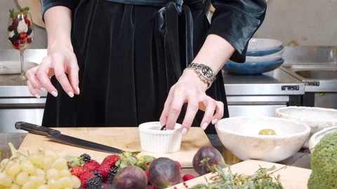 Female hands preparing delicious appetizers from olives in the kitchen Stock Footage 145204920