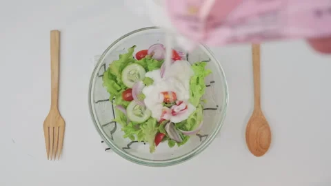 Female hands preparing delicious healthy food at home, organic vegetable salad Stock Footage 243194053