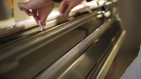 Female hands preparing for work on weaving machine in textile workshop Stock Footage 87377310