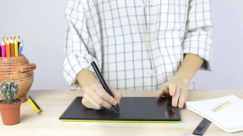 Female hands on a professional graphics tablet Stock Footage 104479255