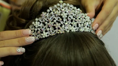 Female hands put the crown on his head Stock Footage 75073721