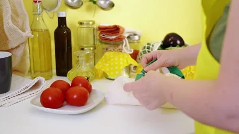 Female hands put vegetables in reusable cotton bag Stock Footage 159142048