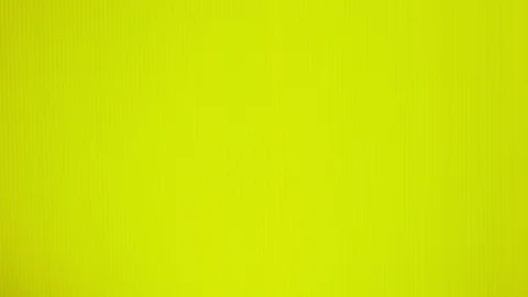Female hands put yellow mango on a bright yellow background. Minimal fruit Stock-Footage 100288723