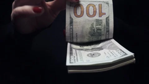 Female hands quickly count cash on black background Video stock 101632762