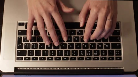 Female hands with a ring typing text on a keybordy, the view from the top. 스톡 동영상 66557472