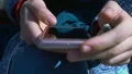 Female hands scrolling smartphone photos, student checking social networks HD Footage