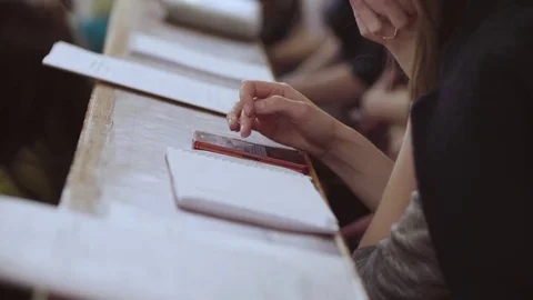 Female hands scrolling something in the smartphone 스톡 동영상 76902452
