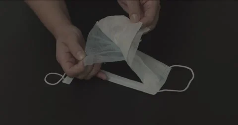 Female Hands Separating Face Mask Layers Stock Footage 152783706