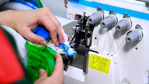 Female hands on sewing machine. Close up of seamstress work. Stock Footage 321612494