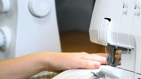 Female hands on sewing machine. Close up of seamstress work. Stock Footage 328228649