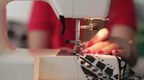 Female hands sewing use the sewing machine, close up Stock Footage 64017791