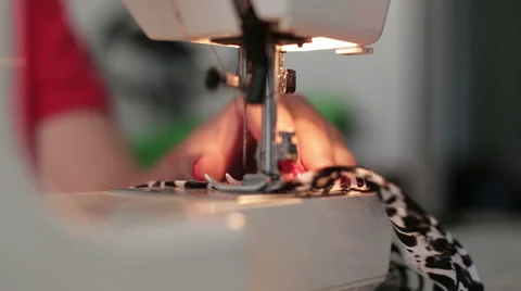 Female hands sewing use the sewing machine, close up Stock Footage 64048563
