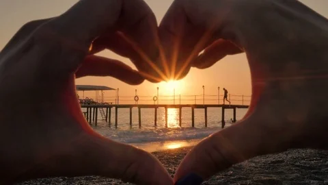 Female hands in the shape of heart. The concept of love, holiday, happiness. Stock Footage 81500532