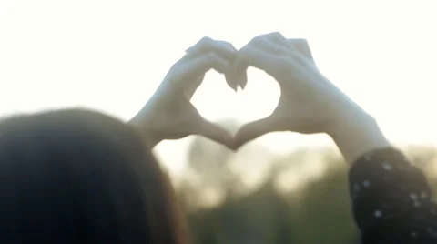 Female Hands in Shape of Love Heart Towards the Sky Stock Footage