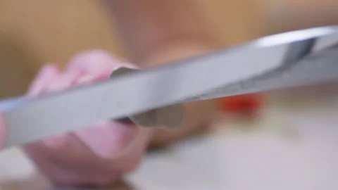 Female Hands Sharpens a Knife on Old, Dirty, Scratched a Steel Rod in Kitchen Stock-Footage 163812632