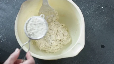 Female hands sifts the flour Stock Footage