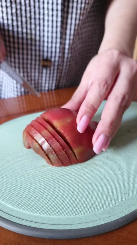 Female Hands Slicing Tomato on Kitchen Board, Close Shot Stock Footage 338188764