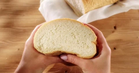 Female hands squeeze fresh bread. Check bread freshness. Stock Footage 242446133