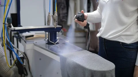 Female hands steaming clothes during cleaning Video stock 108183953