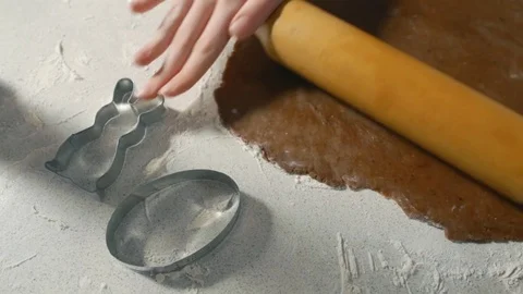 Female hands stretch dough for the Easter cookies Stock Footage 71037049