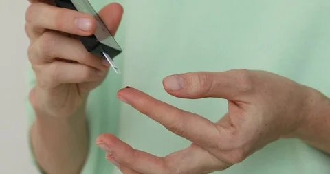Female hands taking blood sample for sugar testing Stock Footage 88135205