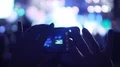 Female hands taking pictures on phone at concert, using gadget to save memories HD Footage
