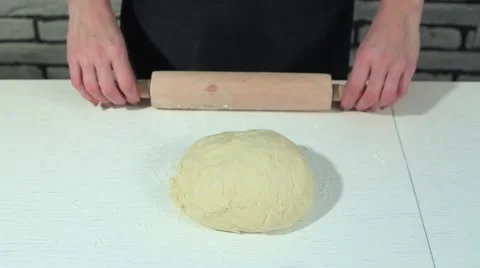 Female hands taking rolling pin for making dough on board Stock Footage 68909328