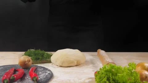 Female hands throw the dough on the surface of the table. Stock-Footage 227343743
