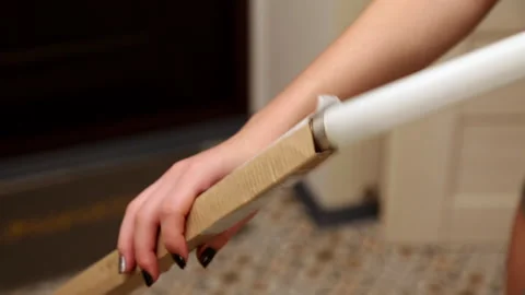 Female hands thrust a long lamp into a box. Full HD Video stock 141611435