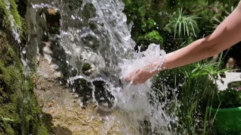 Female hands touching flowing spring water Stock Footage 158320309