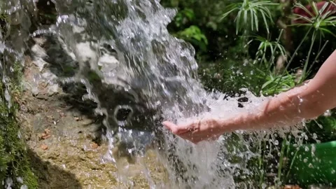 Female hands touching flowing spring water Stock Footage 158320725