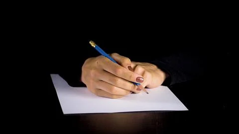 Female hands trying to write a statement. 写真素材