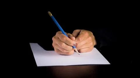 Female hands trying to write a statement. 스톡 사진