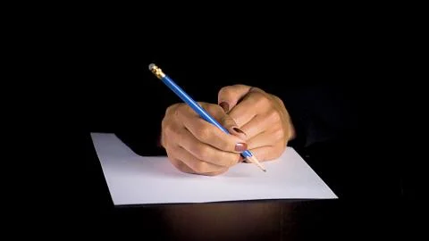Female hands trying to write a statement.  스톡 사진