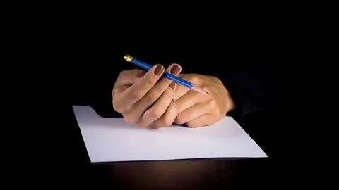 Female hands trying to write a statement.  Foto stock