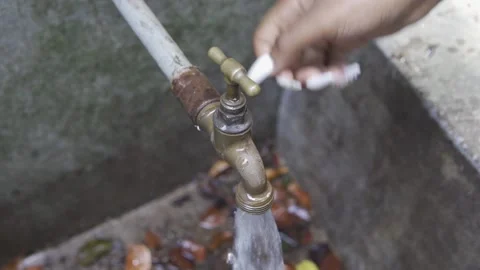 FEMALE HANDS TURN ON PIPE Video stock 145451159