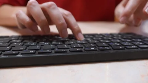 Female hands typing on black computer keyboard Stock Footage 327663901