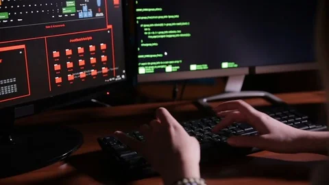 Female hands typing computer code, hacking computer at a dark room. Hacker Stock Footage 69794399