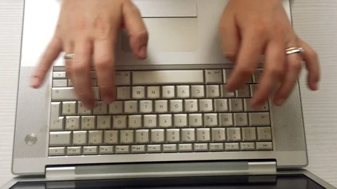 Female hands typing on a computer keyboard Stock Footage 89486318