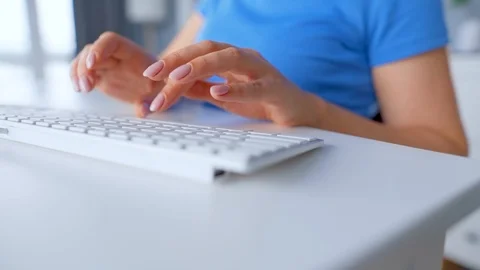 Female hands typing on a computer keyboard. Concept of remote work. Stock Footage 124213921