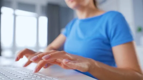 Female hands typing on a computer keyboard. Concept of remote work. Accelerated Stock Footage 124213946