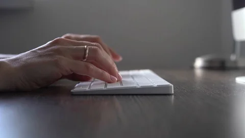 Female hands typing computer keyboard Stock Footage 129142576