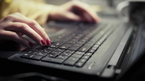 Female hands typing on computer keyboard in the night Stock Footage 132678585