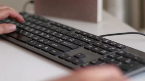 Female hands typing on computer keyboard on white table, close-up. Concept of Stock Footage 134561475