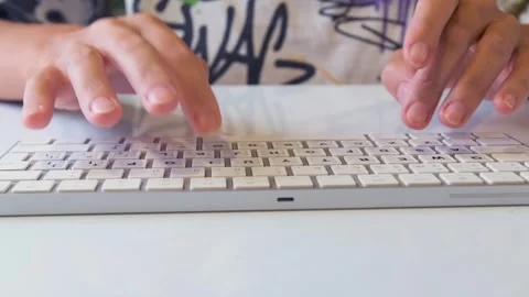 Female hands typing on computer keyboard, close up of fingers working on desktop Stock Footage 333728648