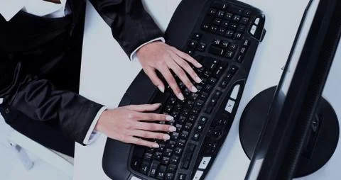 Female hands typing on computer keyboard Stock Photos