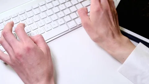 Female hands typing on the keyboard Stock Footage 76736574