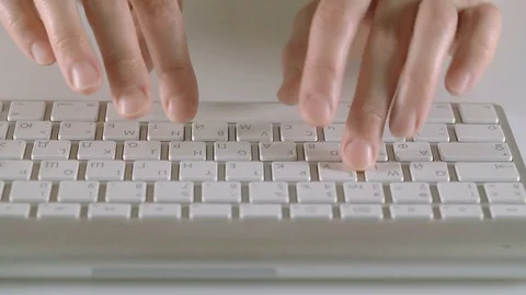 Female hands typing on a keyboard on white background Stock Footage 74687810